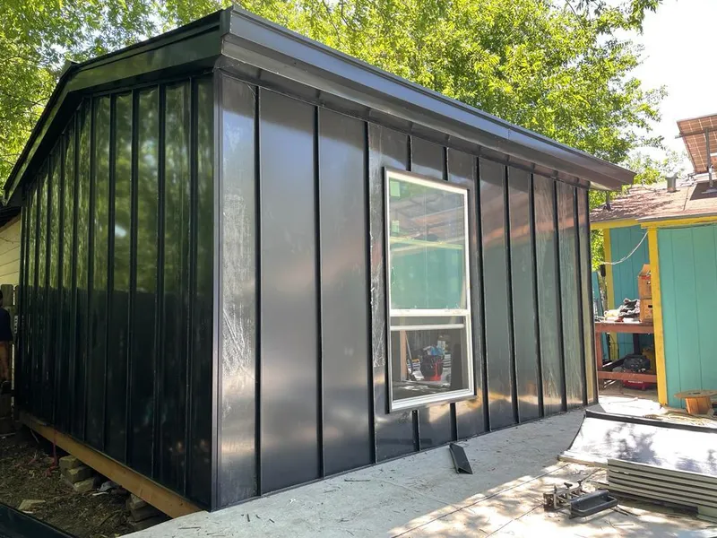 Black standing seam metal wall panels for Roof Inspection in Kirkland